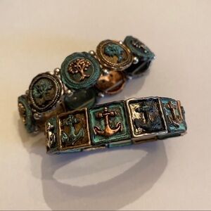 Two bronze and blue stretchy bracelets with anchors away and trees